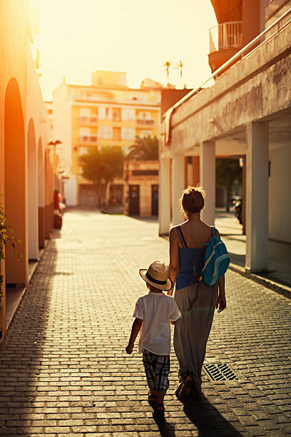 Mother and son walking to school