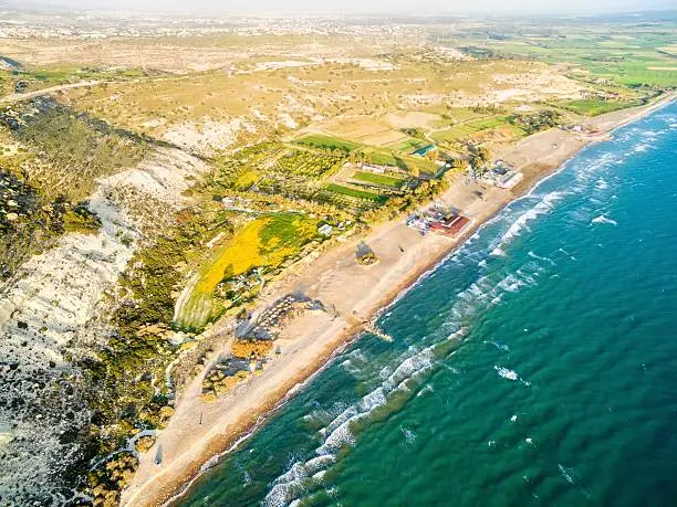 Aerial view of the arcaeological site of the ancient city of Kourio which is located in the district of Limassol, Cyprus. A view of the ancient theatre and the beach from the hill.