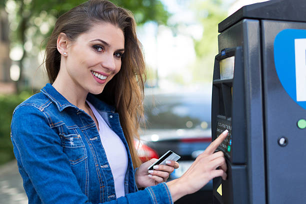 istock Woman paying for parking 540528982