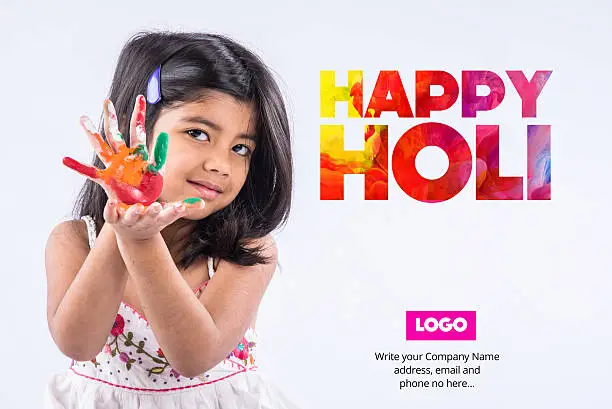 Photo of happy holi greeting card using indian girl with colourful palm