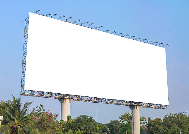 istock large blank billboard on road with city view background 540531884