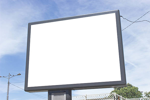 istock Blank billboard against blue sky and clouds 540532328