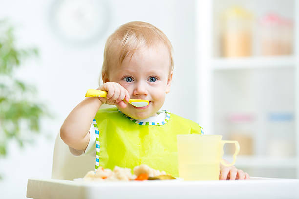istock kid eating healthy food 540565378