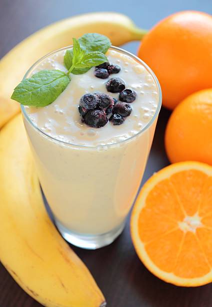 Smoothie with banana and blueberries stock photo