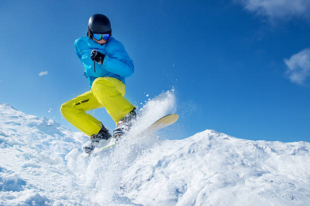 istock Snowboarder jumping high in the air 540565950
