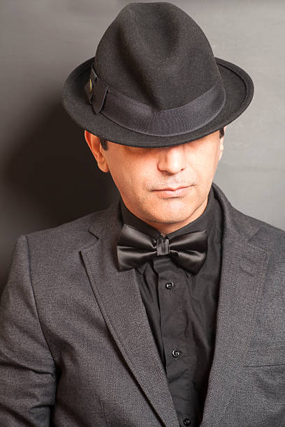 istock Man wearing a black suit and bow tie 540566308