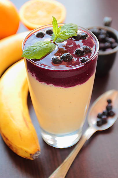 Smoothie with banana and blueberries stock photo