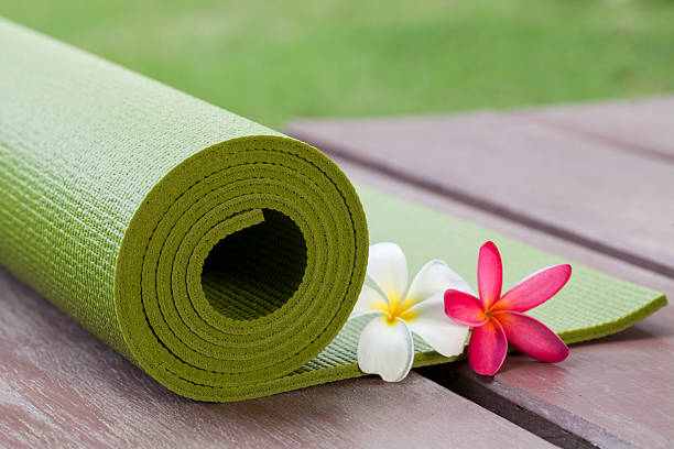 istock green yoga mat and a flowers 540568022