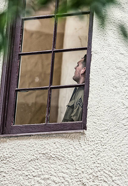 istock World War Two US Army Soldier Daydreaming At Window 540568410