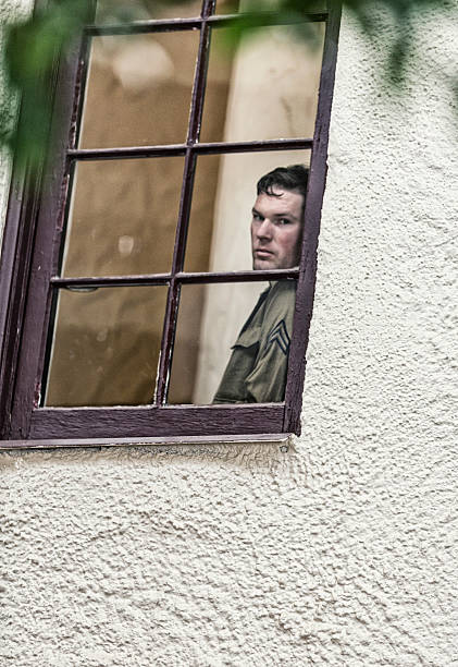 istock WWII US Army Corporal Military Soldier Looking Through Window 540568518