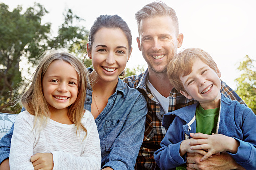 Portrait of a happy family spending time together outdoors