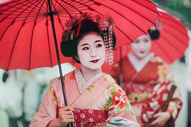 Japanese girls in Kimonos Maiko girls, Geisha apprentices, Kyoto, Japan parasol photos stock pictures, royalty-free photos & images