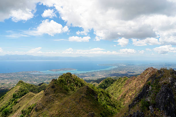 istock View from mountains to tropical sea under cloudy blue sky 540569664