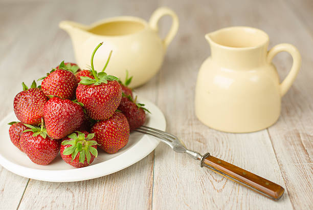 istock Ripe strawberry fruits on a white plate 540572862