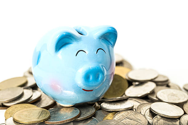 istock piggy bank over coins stack isolated on white 540574140