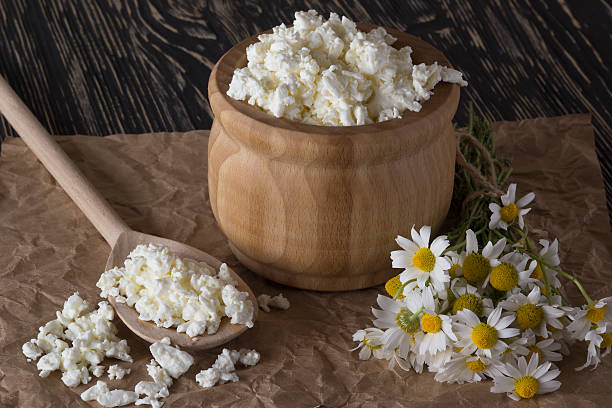 istock Cottage cheese and chamomile flowers 540575082
