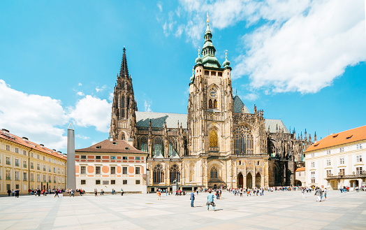 Prague, Czech Republic - May 20, 2016: Prague castle. Lovely spring day. People walking near St.Vitus Cathedral - the largest and most important church in the Czech Republic. 