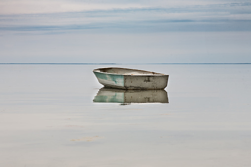 lone rowing boat adrift