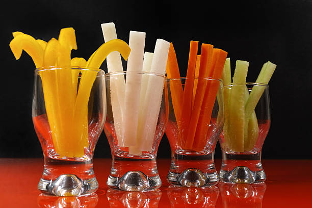 istock Healthy snacks - colorful vegetable sticks in glass 540580928