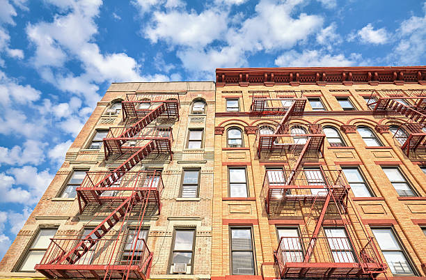 istock Residential building with fire escape ladders in NYC. 540581234