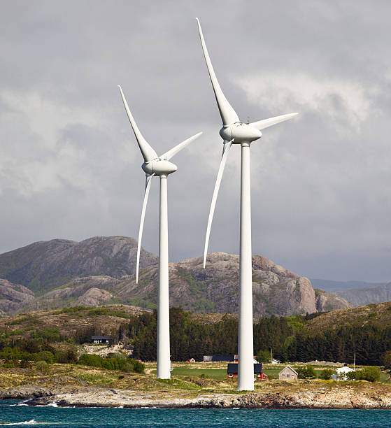 Wind turbines on the coastline of Norway, located west of the village of Oksvoll.  The village is situated between Trondheim and Rorvik, Norway, on the route taken by the Hurtigruten ship line.