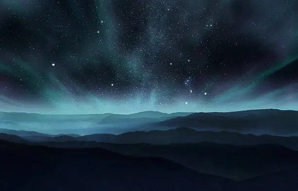 Starry night sky with aurora over the hills