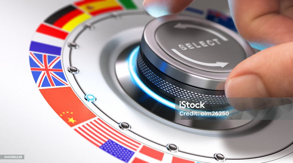 Languages Concept Hand turning a selection knob with many different flags around it. Concept of languages and multilingual support. Composite image between a photography and a 3D background. Translation Stock Photo