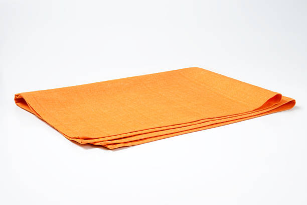folded orange napkin stock photo