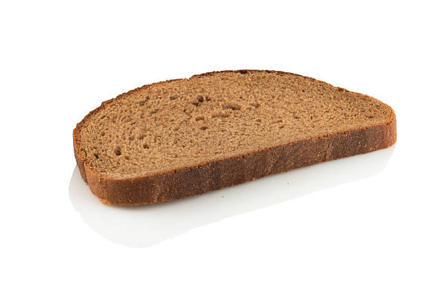 istock slice of rye bread on white background 540587850