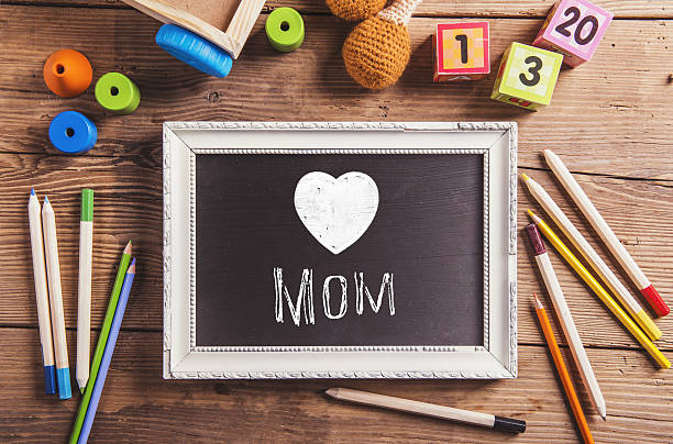 istock Mothers day composition, various toys. Picture frame, studio sho 540587876
