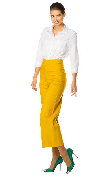 istock Young woman in yellow pants 540588280