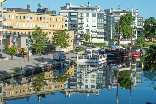 Linkoping, Sweden - June 3, 2016: Summer morning by river Stangan in Linkoping. Linkoping is a famous University town in Sweden.
