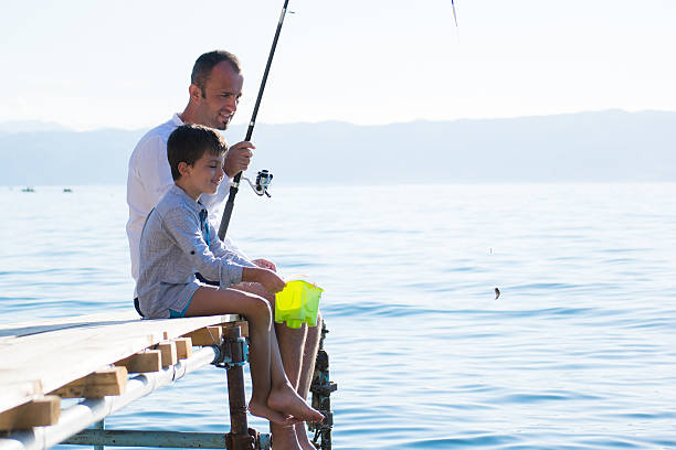 istock Father and son fishing 540589906