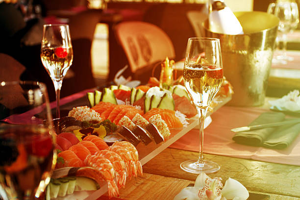 istock Restaurant table with sushi plate and champagne glasses 540590170