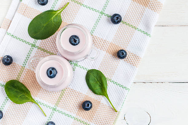 istock blueberry yogurt on wooden white background, top view, flat lay 540591044
