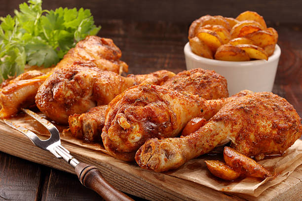 istock Roasted chicken legs with potato chips and vegetables 540593300