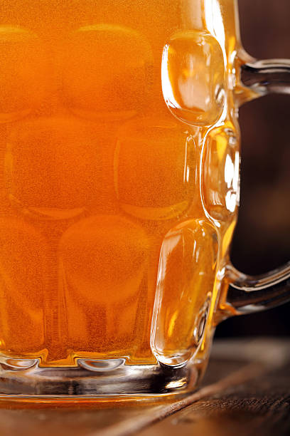 istock Pint of beer on wooden background with space for text 540593696