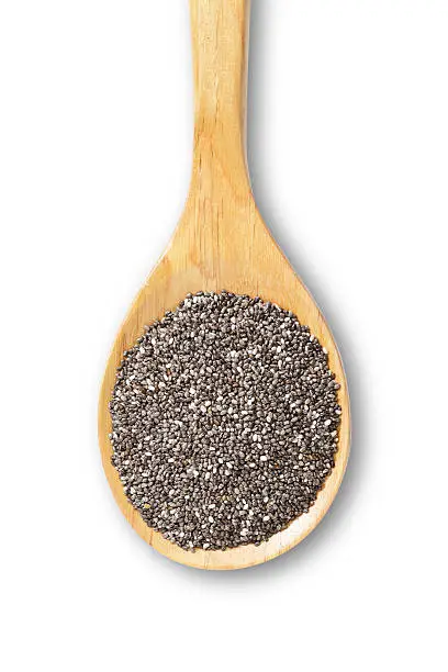 Wooden spoon with chia seeds isolated on white background. DSRL studio photo taken with Canon EOS 5D Mk II and Canon EF 100mm f/2.8L Macro IS USM