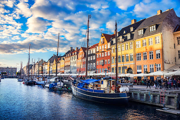colorful traditional houses in copenhagen old town nyhavn at sunset - copenhagen bildbanksfoton och bilder