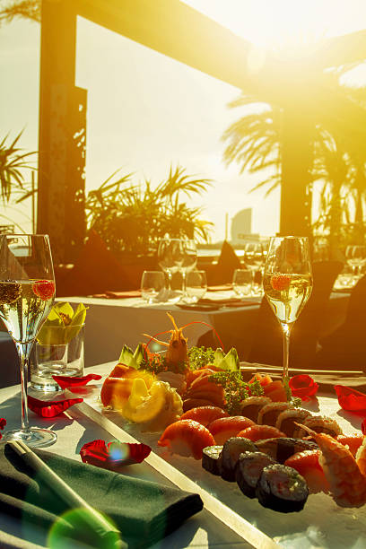 istock Sunrise and luxury restaurant table with sushi and champagne 540596014
