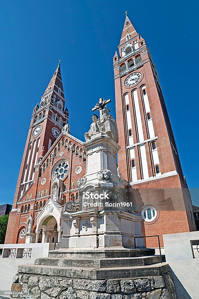 Votive church in Szeged, Hungary Votive Church of Our Lady of Hungary in Szeged. Construction began in 1913 and it was completed at 1930. Arcade Stock Photo