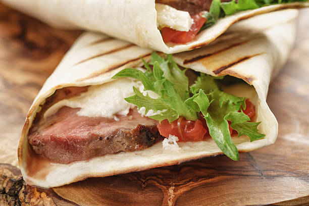 istock fresh homemade burritos with beef on olive cutting board 540600502