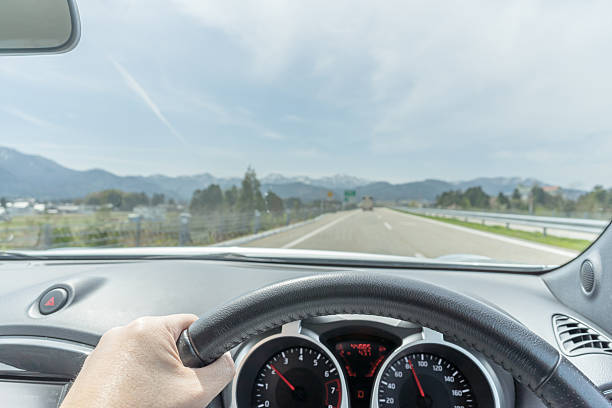 istock Hand of a driver on steering wheel on a highway 540601150