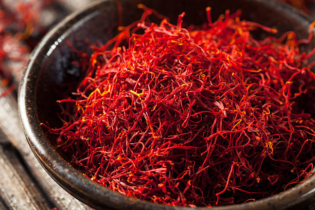 Raw Organic Red Saffron Spice Raw Organic Red Saffron Spice in a Bowl pistil photos stock pictures, royalty-free photos & images