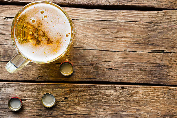 istock light beer mug on the wooden background 540601748
