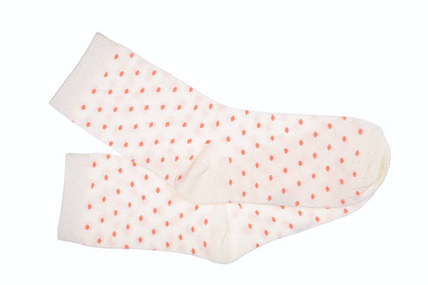 istock White polka dot childish socks isolated. 540602684