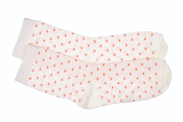 White polka dot childish socks isolated.