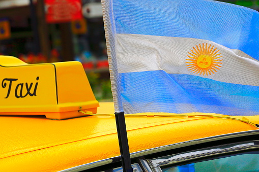 Taxi and patriotic Argentinean flag, Ezeiza airport, Buenos Aires - Argentina
