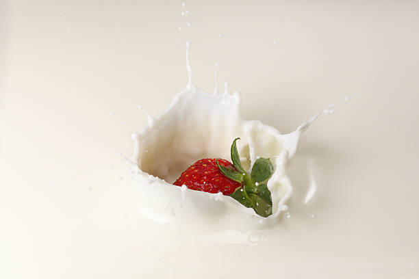istock Splashing Strawberry into Milk 540606774