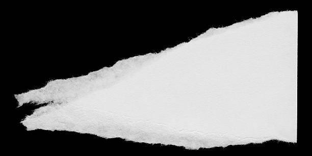 istock Torn White Paper Edge Scrap Isolated on Black Background 540607540